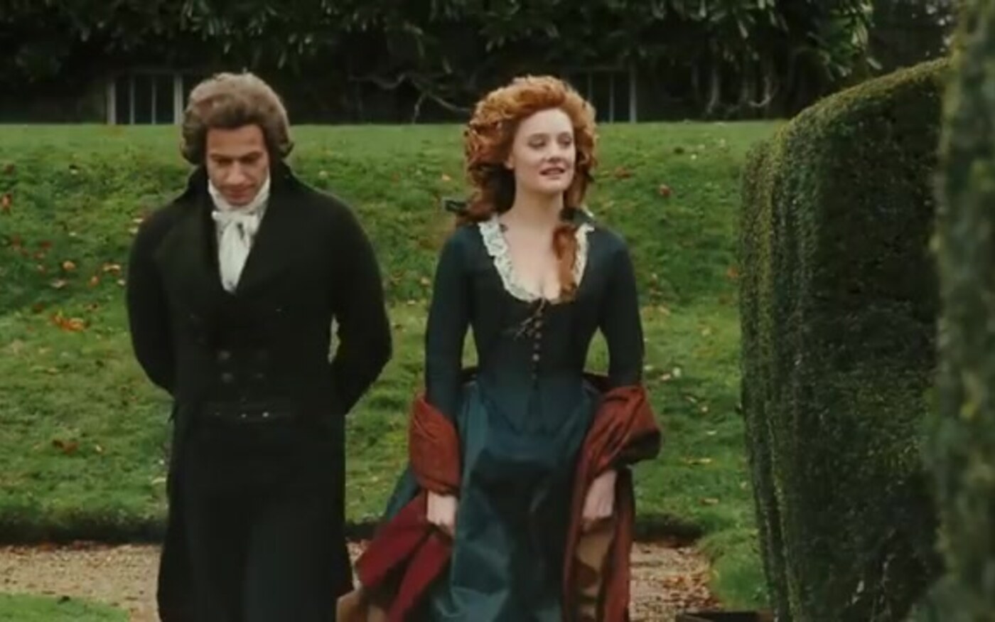 Ioan Gruffudd as William Wilberforce walks a garden path with Romola Garai as Barbara Spooner in Amazing Grace